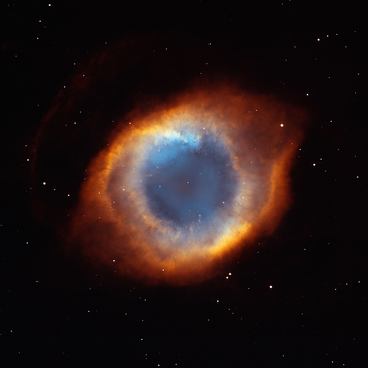 colorful picture of the ring nubula which looks like a giant human eye