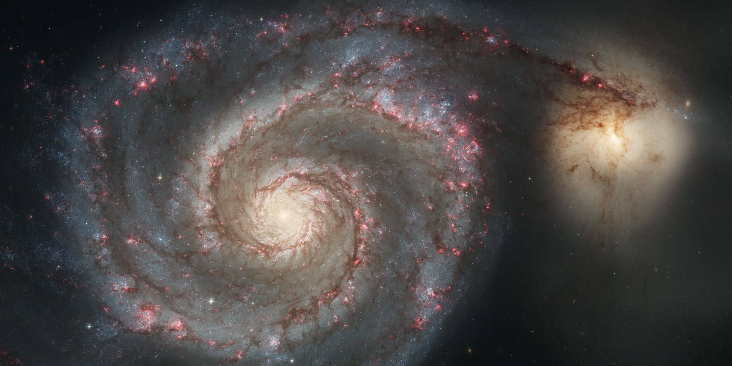 The Whirlpool Galaxy, also known as Messier 51a, M51a, and NGC 5194, is an interacting grand-design spiral galaxy with a Seyfert 2 active galactic nucleus. 